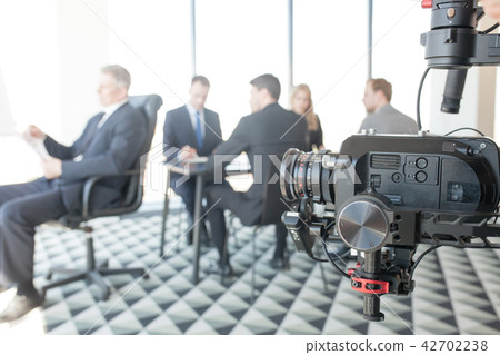 Videographer making video of business people Videographer making video of business people 42702238