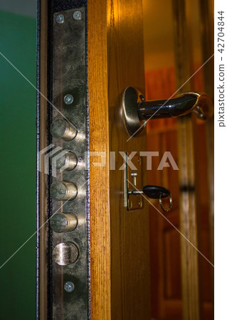 A slightly open front door. A slightly open front door. 42704844