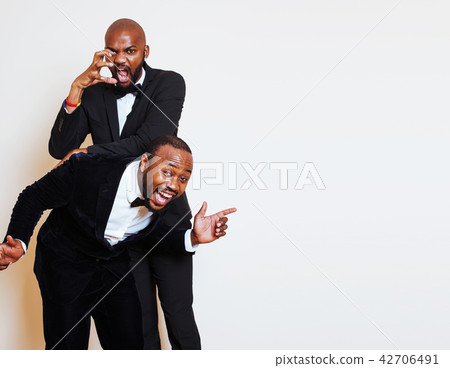 two afro-american businessmen in black suits emotional posing, g two afro-american businessmen in black suits emotional posing, g 42706491
