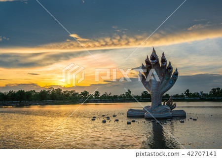 Beautiful Naga statue during sunset Beautiful Naga statue during sunset 42707141