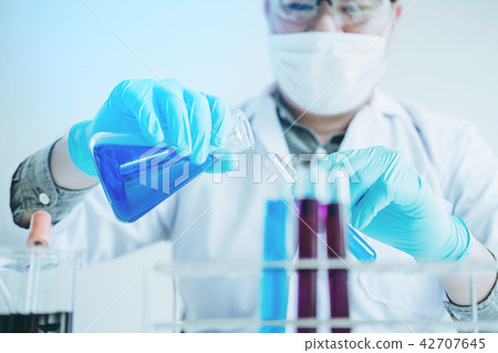 Scientist with equipment holding tools during  42707645