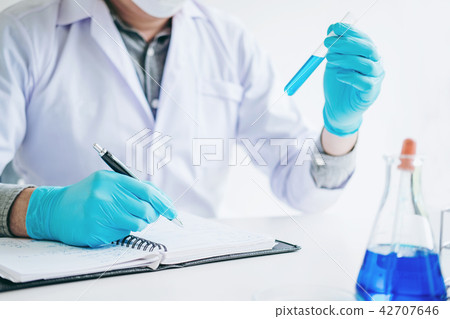 Scientist with equipment holding tools during Scientist with equipment holding tools during 42707646