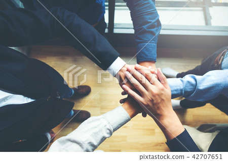 Business Teamwork joining hands team spirit 42707651