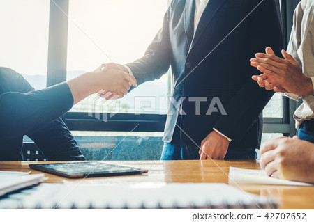 Business people colleagues shaking hands Business people colleagues shaking hands 42707652
