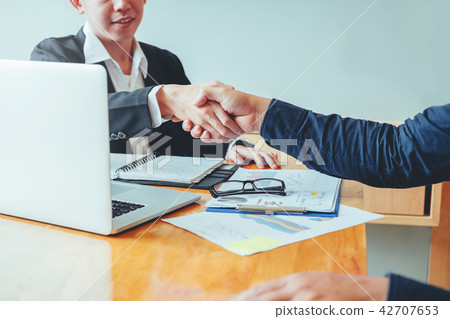 Business people colleagues shaking hands meeting Business people colleagues shaking hands meeting 42707653