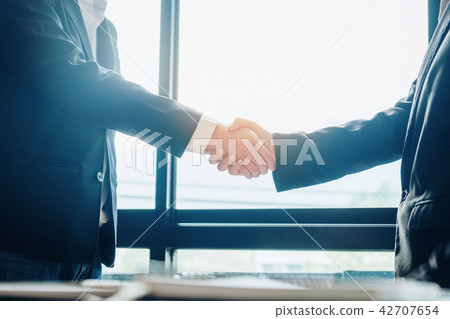 Business people colleagues shaking hands meeting Business people colleagues shaking hands meeting 42707654