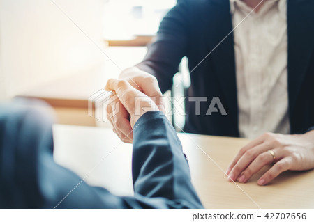 Business people colleagues shaking hands meeting Business people colleagues shaking hands meeting 42707656