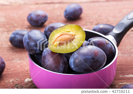 fresh plums on the table 42710211