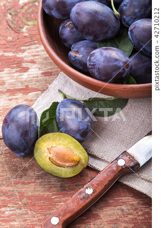 Fresh plums on the table 42710212