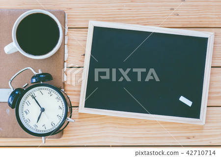 Blackboard  and cup of coffee with  cookies 42710714