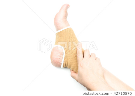 Woman with ankle support, foot injury isolated  42710870