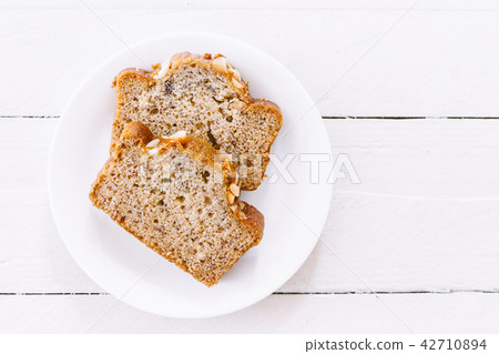 Banana cake on wooden background Banana cake on wooden background 42710894