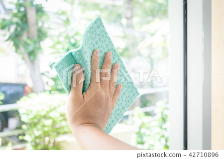 Hands cleaning the window Hands cleaning the window 42710896