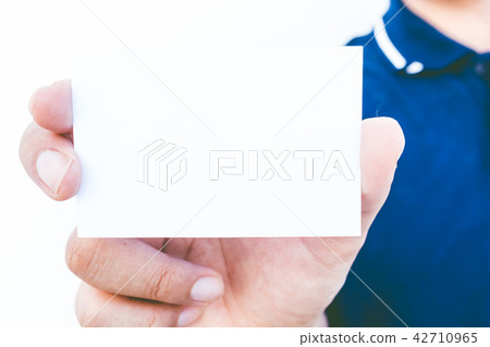 Man hand holding a blank business card Man hand holding a blank business card 42710965