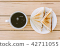 Sandwich with coffee cup on wooden table 42711055