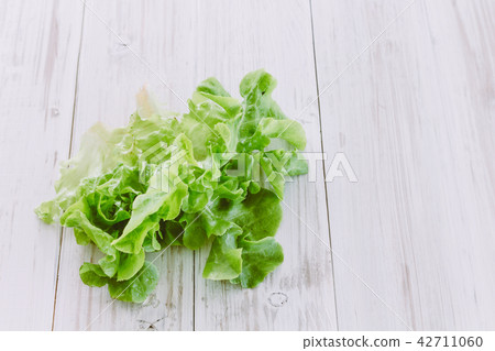 Green vegetables on wooden background  42711060
