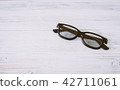 Fashion sunglasses on wooden table 42711061