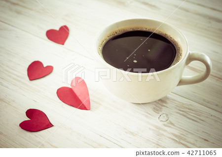Heart and coffee on a wooden background Heart and coffee on a wooden background 42711065