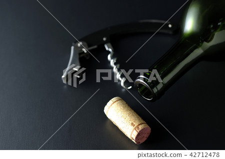 Wine bottle and cork and opener 42712478