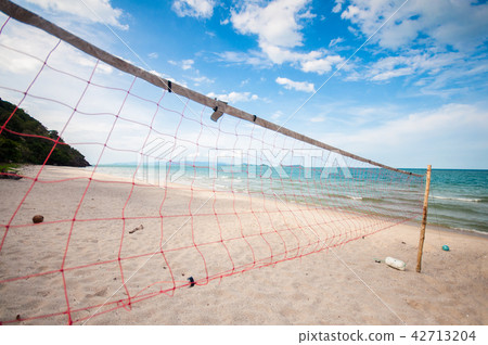 Net of beach volleyball stand alone along beach Net of beach volleyball stand alone along beach 42713204