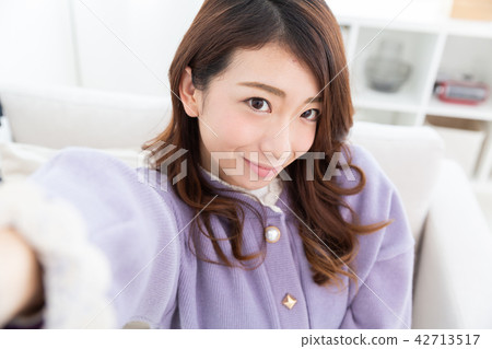 A woman taking self-taking 42713517