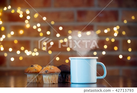 classic and chocolate cupcakes and cup of tea 42713793