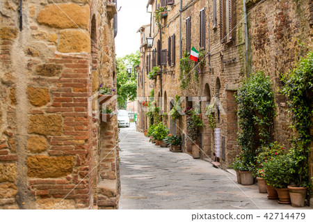 Beautiful street in a small old village Pienza, Tuscany. Beautiful street in a small old village Pienza, Tuscany. 42714479