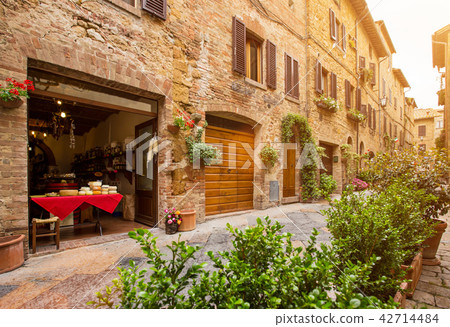 Beautiful street in a small old village Pienza, Tuscany. Beautiful street in a small old village Pienza, Tuscany. 42714484