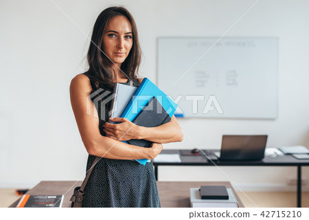 Female student smiling and looking at camera. 42715210