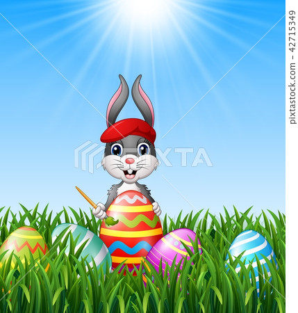 Easter bunny painting easter eggs 42715349