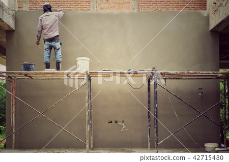 Workers installing bricklayer Workers installing bricklayer 42715480
