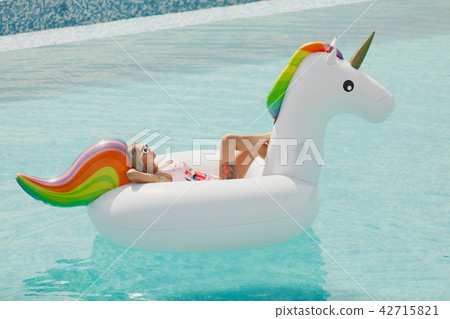 Enjoying suntan Woman in bikini in the swimming pool. Summer Vacation 42715821