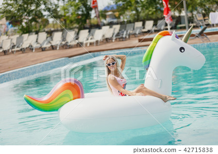 Enjoying suntan Woman in bikini in the swimming pool. Summer Vacation 42715838