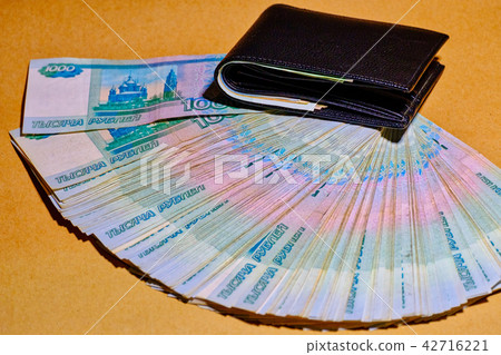 Fun of Russian Money in a leather wallet on craft paper background Fun of Russian Money in a leather wallet on craft paper background 42716221