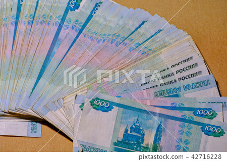 A lot of bills one thousand rubles as fan A lot of bills one thousand rubles as fan 42716228