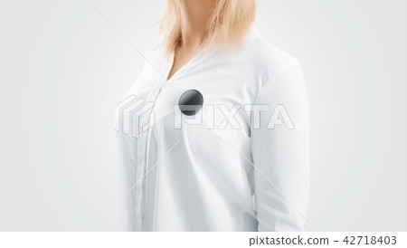 Blank black button badge mockup pinned on chest Blank black button badge mockup pinned on chest 42718403