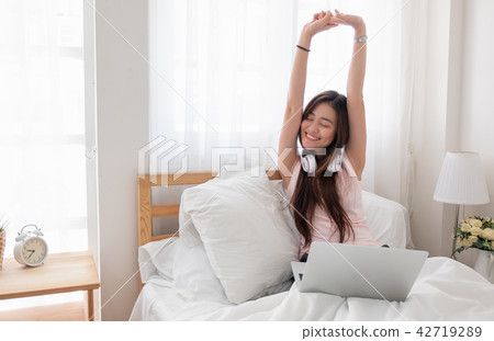 Asian woman wear top tank raise arms up 42719289