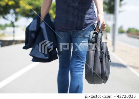 man in a smart casual look on the street man in a smart casual look on the street 42720026