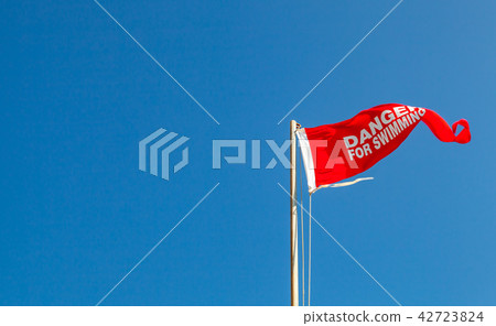Danger for swimming. Red warning flag Danger for swimming. Red warning flag 42723824