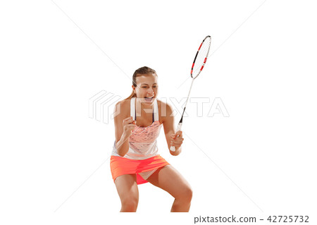 Young woman playing badminton over white background Young woman playing badminton over white background 42725732