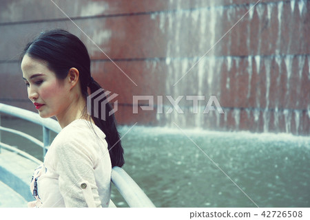 Beautiful girl happy playing tablet device working Beautiful girl happy playing tablet device working 42726508