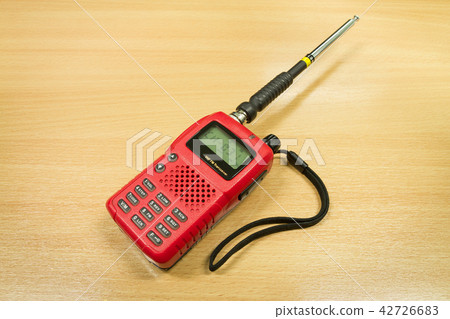 VHF FM transceiver on wooden table background 42726683