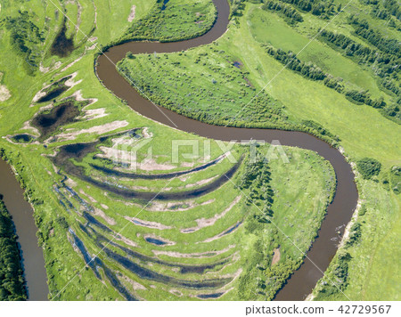 Aerial landscape of winding river in green fields 42729567