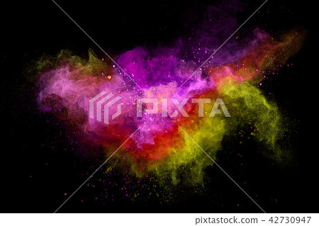 Colored powder explosion on black background. 42730947
