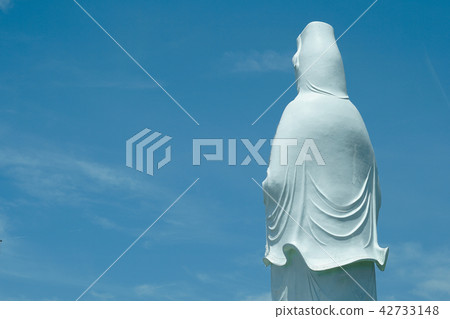 Bodhisattva statue in sky background Bodhisattva statue in sky background 42733148