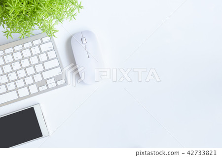 White desk office with laptop, smartphone and othe White desk office with laptop, smartphone and othe 42733821