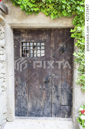 ancient wooden door with a lattice  42733947