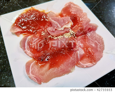 Sliced raw pork on white dish 42735933