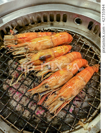 Grilling prawn on charcoal stove Grilling prawn on charcoal stove 42735944