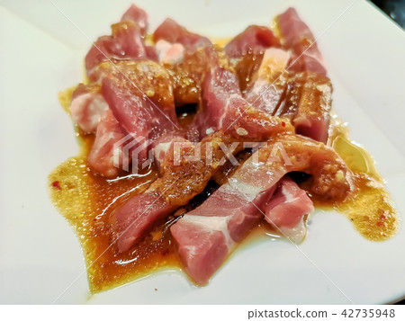 Sliced raw pork on white dish 42735948